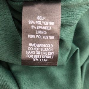 wonder whirl dark green twist back skater dress